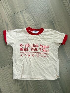 The Mayfair Group Cream Ringer Tee with Red Trim and Graphic